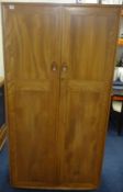 Ercol, a two door wardrobe.