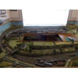 An assembled N gauge model railway layout and rolling stock. THIS LOT IS NOT AT THE SALEROOM. Please