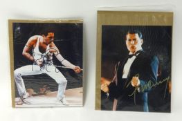 Freddie Mercury, two signed photographs with certificates, unframed approx 26cm x 20cm.