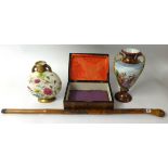 A carved bamboo walking stick, floral patterend moon flask, Victorian vase and a walnut