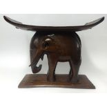 A carved wood elephant stool, height 49cm.