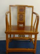 A pair of Chinese light wood elbow chairs with decorated back panels, height 85cm.