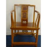 A pair of Chinese light wood elbow chairs with decorated back panels, height 85cm.