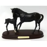 A Beswick model of 'Black Beauty & Foal' on wood base, 20cm