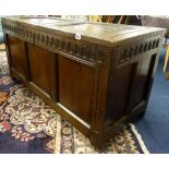 Carved oak blanket chest fitted with a candle box and panelled decoration, width 121cm.