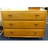 Ercol, a chest fitted with drawers.
