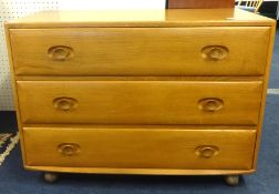 Ercol, a chest fitted with drawers.