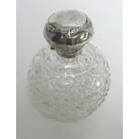 A silver mounted scent bottle.