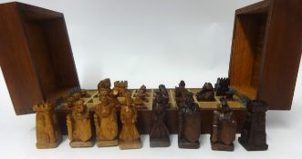 A modern carved wood chess set.