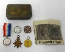 Great War Mary tin and a trio of group of medals awarded to ART. ENG. T.A.WOODISSE. R.N. also an