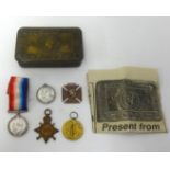 Great War Mary tin and a trio of group of medals awarded to ART. ENG. T.A.WOODISSE. R.N. also an