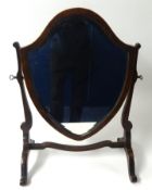 An Edwardian shield back dressing table mirror.
