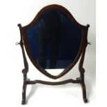 An Edwardian shield back dressing table mirror.