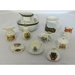 A small collection of crested china including local crests of Buckfastleigh and Plymouth.