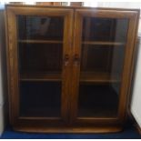 Ercol, a pair of two door bookcases.