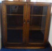 Ercol, a pair of two door bookcases.