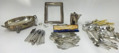 Various silver plated wares, cutlery, serving dish, silver charm bracelet, and silver frame.