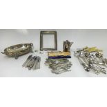 Various silver plated wares, cutlery, serving dish, silver charm bracelet, and silver frame.