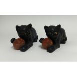 Two Bretby terracotta cats, modelled playing with a balls of wool.