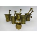 A group of six Continental bronze and brass antique pestle and mortars, the largest 30cm.