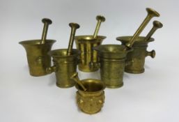 A group of six Continental bronze and brass antique pestle and mortars, the largest 30cm.