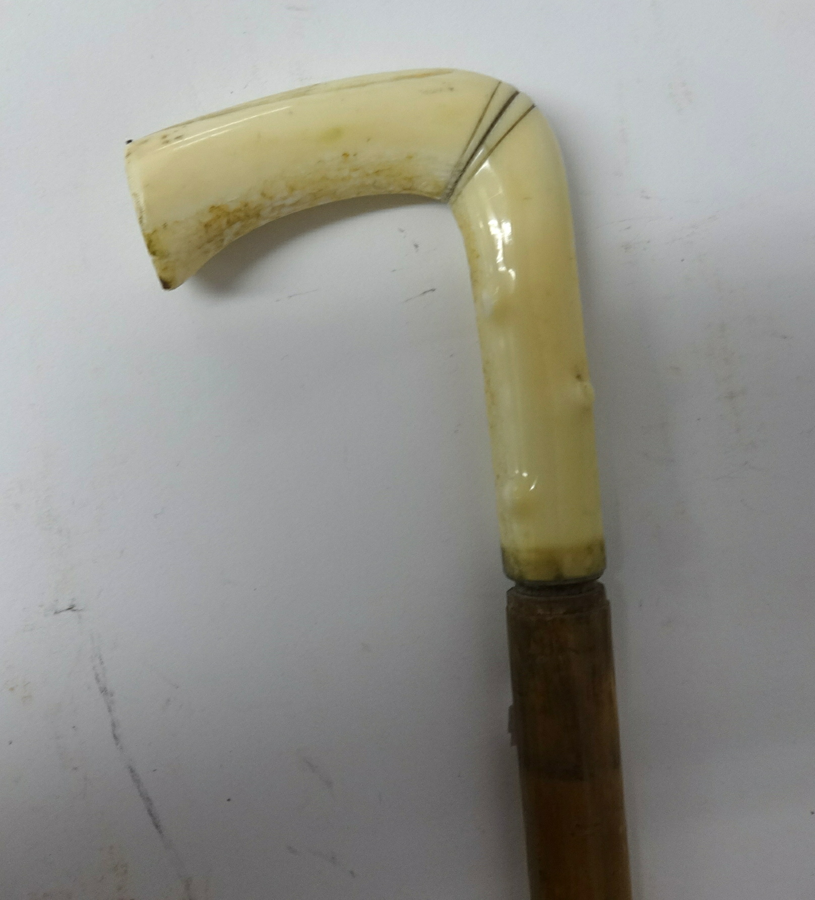 A walking cane with 'scrimshaw' handle and another carved ivory cane (2) - Image 4 of 4
