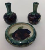 William Moorcroft, a pair small Pansy vases, signed in green, impressed 'Moorcroft & Burslem',