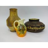 Continental jug with embossed insect, an art pottery vase and bowl with embossed elephant decoration