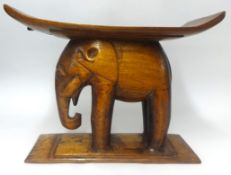 A carved wood elephant stool, height 46cm..