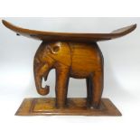 A carved wood elephant stool, height 46cm..