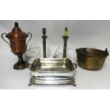 Two silver plated candlesticks, old silver plated ornate food warmer, jam pan and tea urn.