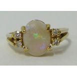 A 14k pearl and diamond ring, finger size N.