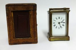 A French brass cased carriage clock with travel box (faults)