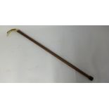 A walking cane with 'scrimshaw' handle and another carved ivory cane (2)