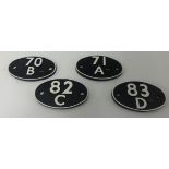 Four oval train plates, 71a, 83a, 70b and 82c, each 18cm wide.