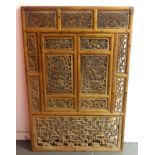 A carved pine Eastern divide screen, 89cm x 135cm