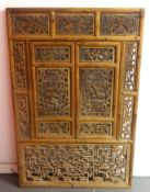 A carved pine Eastern divide screen, 89cm x 135cm