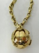A 9ct gold Masonic ball pendant opening to reveal a cross engraved with various