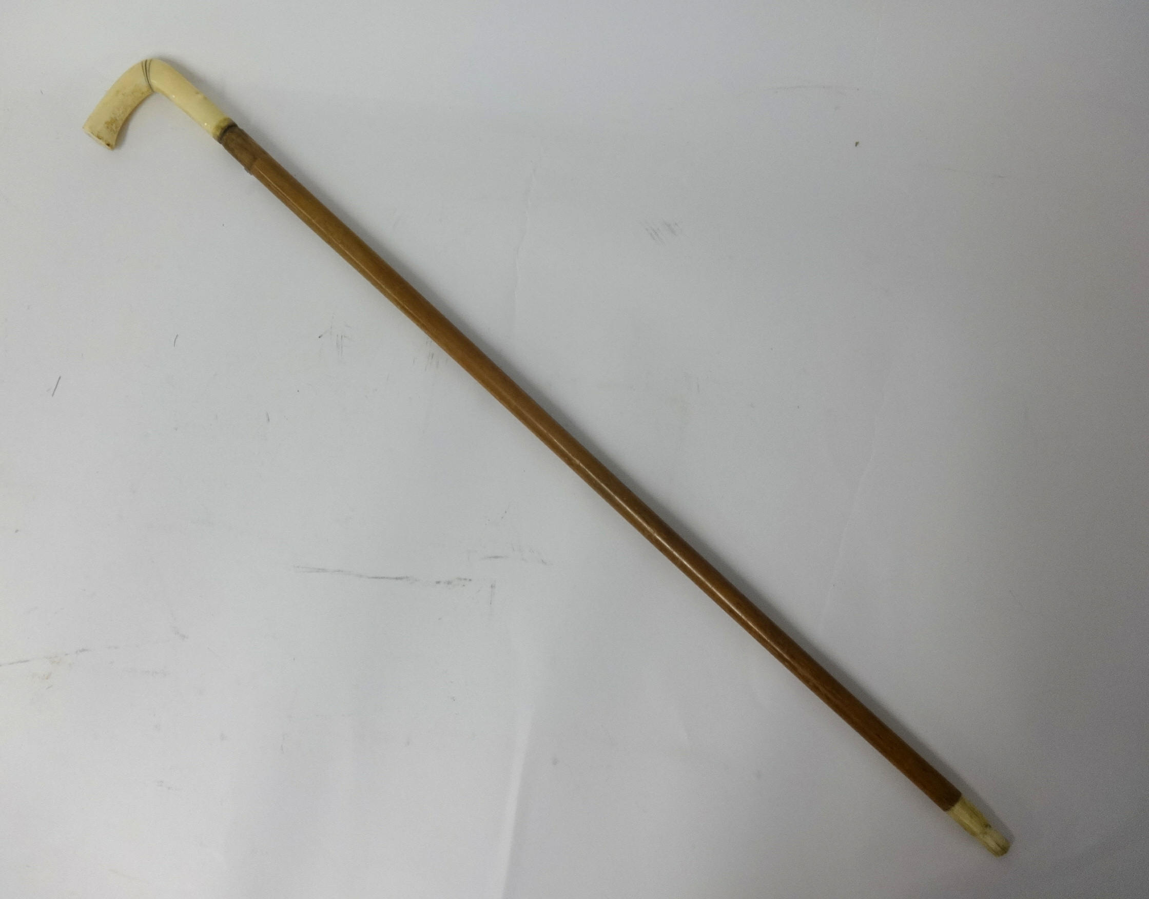 A walking cane with 'scrimshaw' handle and another carved ivory cane (2) - Image 3 of 4