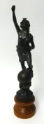 A spelter figure on a turned wood base height 42cm
