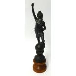 A spelter figure on a turned wood base height 42cm