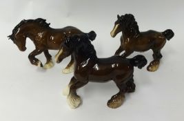 Pair of Beswick cart horses and a similar Royal Doulton horse, 22cm