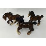 Pair of Beswick cart horses and a similar Royal Doulton horse, 22cm