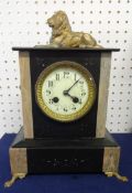 A Victorian slate/marble mantle clock, surmounted with a lion, height 34cm.