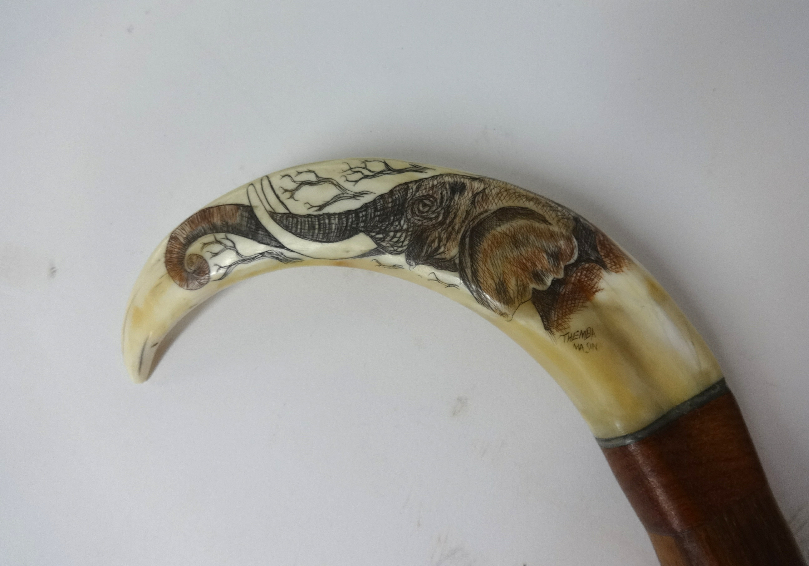 A walking cane with 'scrimshaw' handle and another carved ivory cane (2) - Image 2 of 4