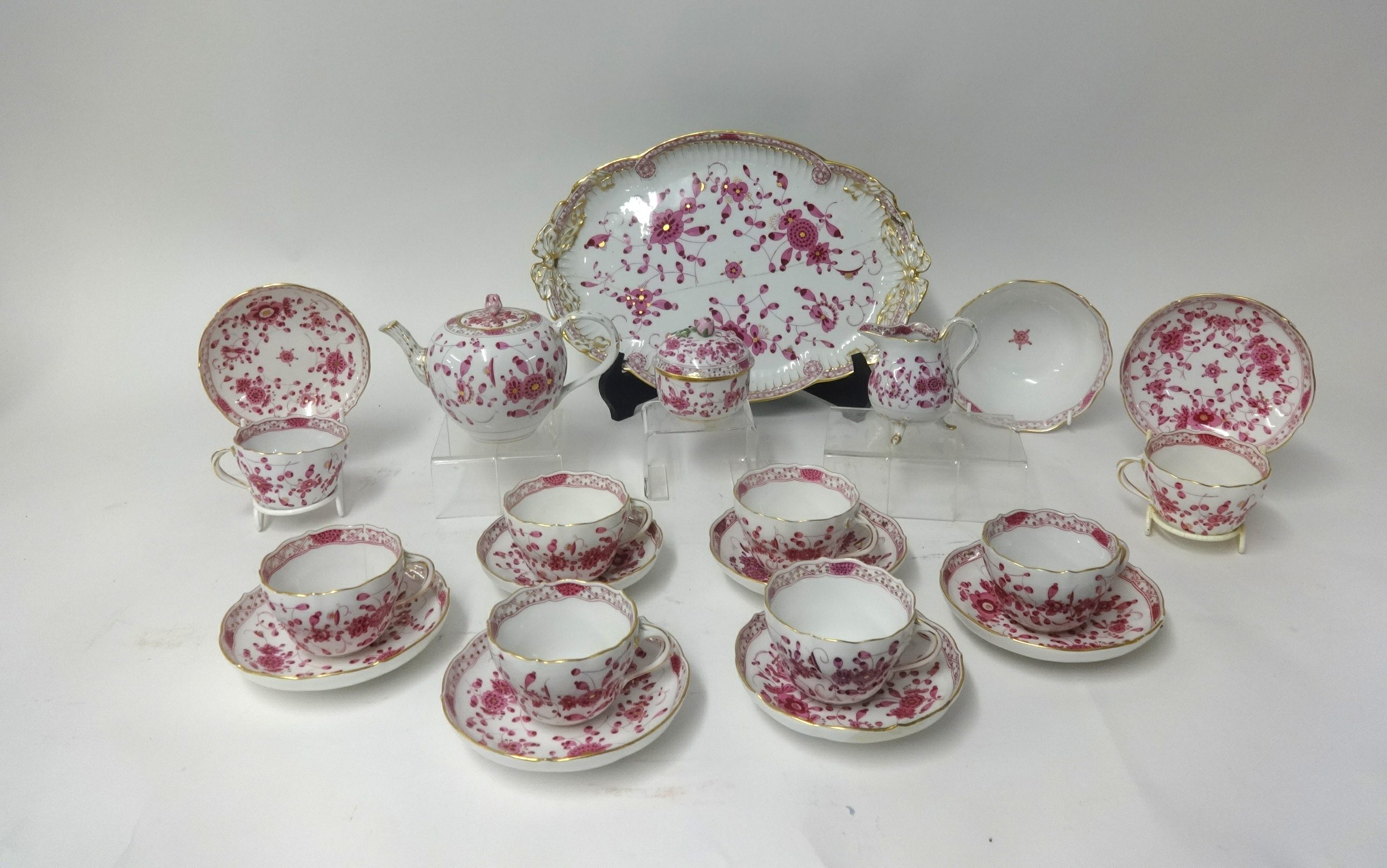 A 19th century Meissen porcelain tea service comprising 8 cups and saucers, tea pot, sugar basin,