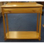 Ercol, a small lightwood hall table with drawer.