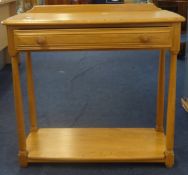 Ercol, a small lightwood hall table with drawer.