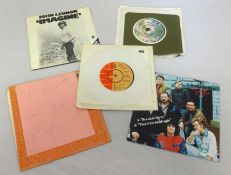 Original 45rpm vinyl records including John Lennon, T-Rex etc.