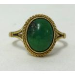 A 9ct green stone cabochon ring, ring size N.